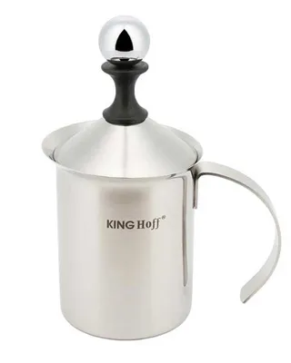 A stainless steel milk frother with a black handle and a chrome ball on top.