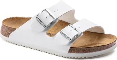 A pair of white Birkenstock Arizona sandals shown from a side angle on a white background.