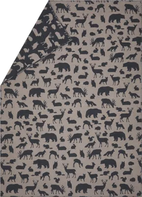 A blanket with a pattern of forest animals.
