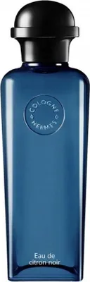 A product shot of a blue glass bottle of perfume with a black cap.