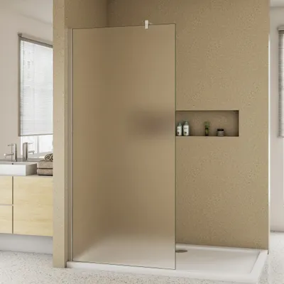 A modern bathroom with a frosted glass shower wall.
