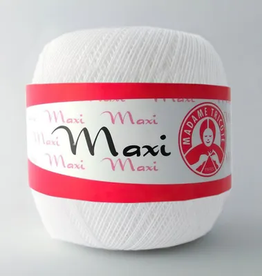 A ball of white yarn with a red and white label.