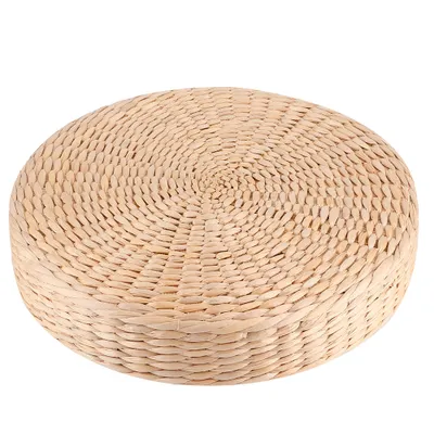 A round, thick seat cushion pouf made of woven natural material, presented on a white background.