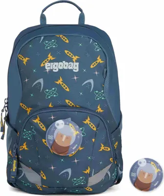A blue backpack with a space-themed pattern and a circular badge featuring a bear astronaut. A separate badge is shown to the right.