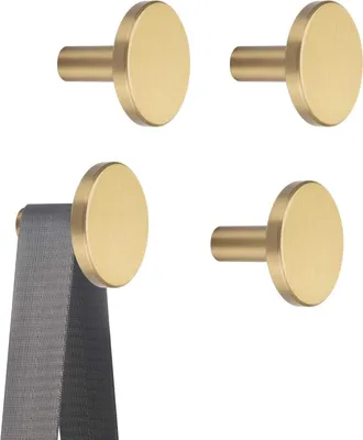 Four gold-colored round wall hooks are shown, with one hook displaying a gray fabric strap hanging from it.