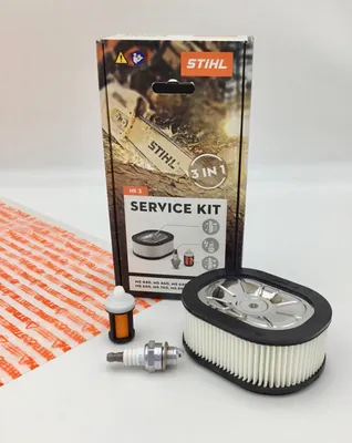A Stihl service kit is displayed on a white and light gray background, with the product packaging in the background and the individual components in the foreground.