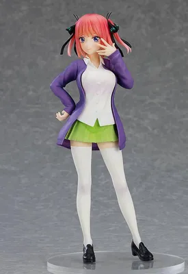 A figurine of an anime character standing against a plain background.