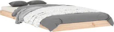 A bed frame with bedding and pillows.