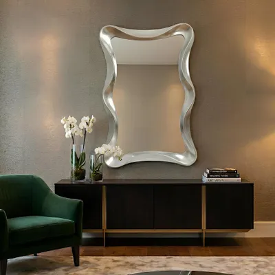 Produktbild von riess-ambiente Moderner Wandspiegel ALICE 120 cm silber variabel aufhängbar gewelltes Design