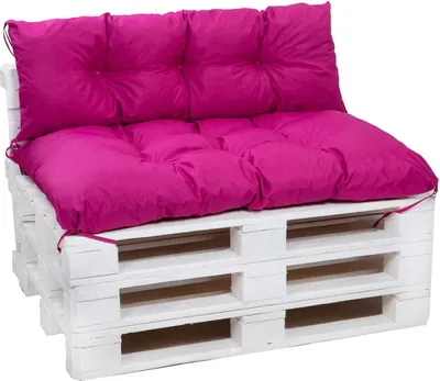 A pink cushion set on a white wooden pallet sofa.