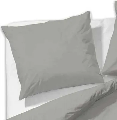 A close-up view of a taupe pillowcase on a white surface.