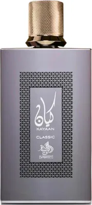 A perfume bottle with a textured gold cap and a gray body, featuring Arabic script and text on the label.