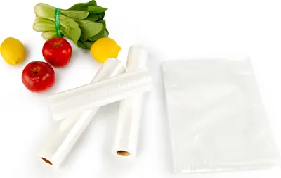 A collection of food items and rolls of plastic wrap on a white background.