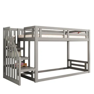 A gray wooden bunk bed with a safety staircase is shown against a white background.