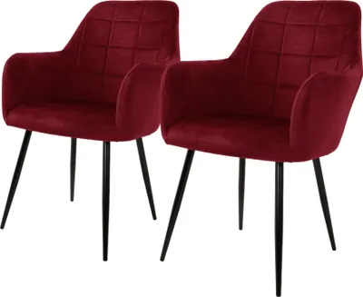 Two burgundy velvet dining chairs with black metal legs are shown against a white background.