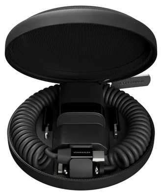A black travel case for a mobile device charger and cables, with the case open and the contents neatly arranged inside.