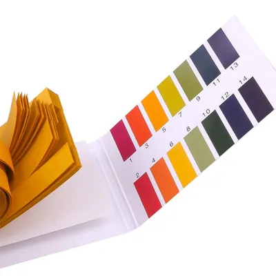 A pH test strip kit with a color chart.