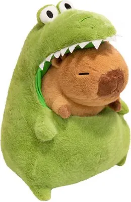 A plush toy of a capybara wearing a green dinosaur costume.