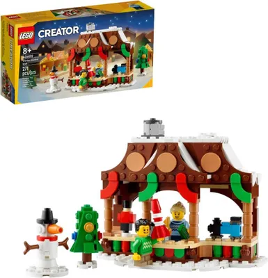 A LEGO Creator gingerbread market stall set with figures and a snowman, shown with its packaging.