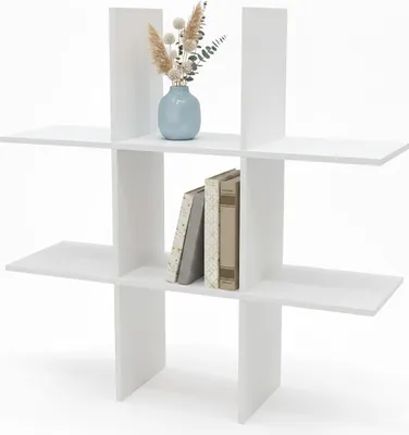 A white shelf unit with decorative items.