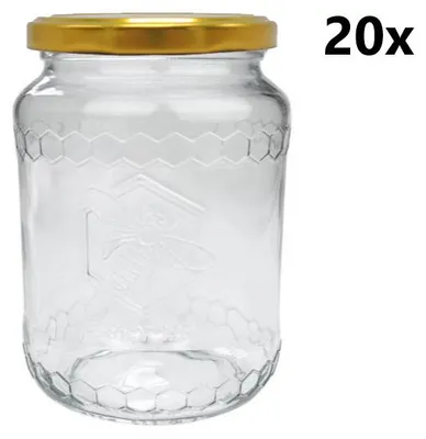 A clear glass jar with a gold lid, featuring a honeycomb pattern and a bee emblem.