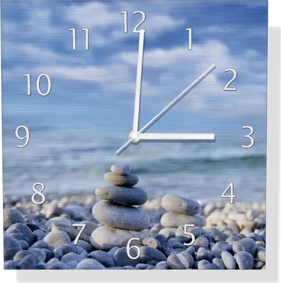 Produktbild von Wallario Design Wanduhr Steinstapel am Strand aus Aluverbund, Größe 30 x 30 cm