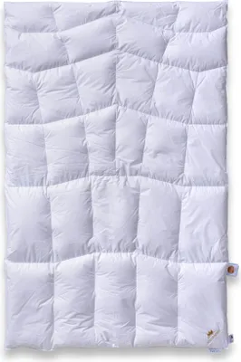 A white down comforter is laid flat on a white background.