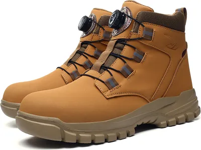 A pair of tan work boots with black laces and a dial closure system.