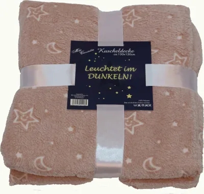 A folded beige blanket with a star and moon pattern, tied with a white ribbon and a product tag.