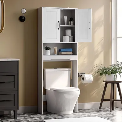 A white bathroom cabinet is shown over a toilet.