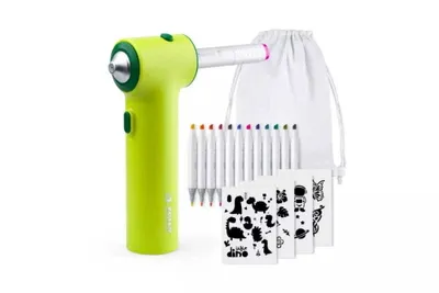 A bright green airbrush set for children, along with markers and stencils, is displayed against a white background.