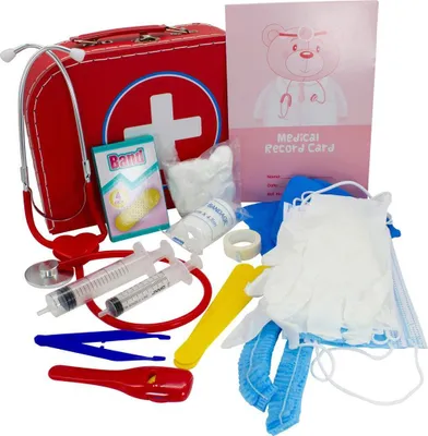A collection of toy medical items, including a doctor's bag, stethoscope, syringes, bandages, gloves, and a medical record card, arranged on a white background.