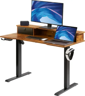 A standing desk with a monitor, laptop, keyboard, and mouse.