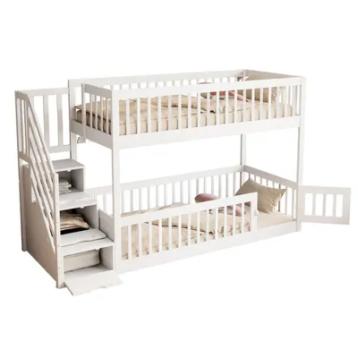 A white wooden bunk bed with a staircase and storage drawers, shown against a white background.
