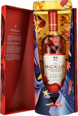 A bottle of Macallan whisky is presented in a decorative gift box with colorful illustrations.