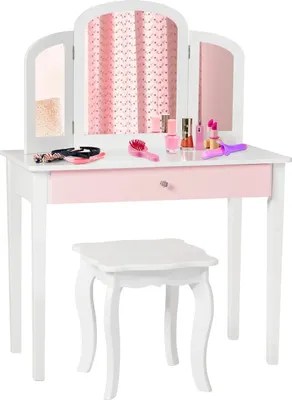 A child's vanity table and stool set with makeup accessories.