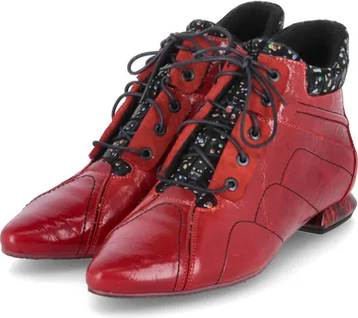 A pair of red lace-up ankle boots with a patterned fabric lining.