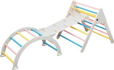 A children's indoor climbing structure with a slide and climbing arch, presented against a white background.