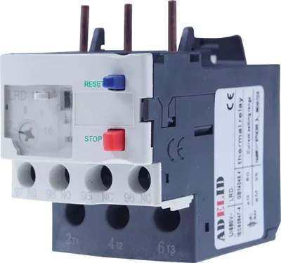 A close-up studio shot of an electrical thermal overload relay.