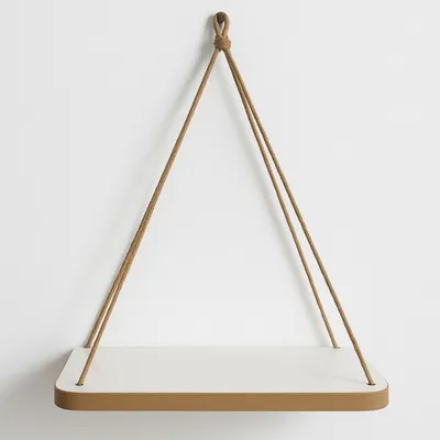 A white shelf with a brown trim, suspended by a brown rope against a white wall.