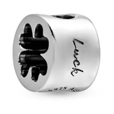 A silver charm with a four-leaf clover design and the word "Luck" engraved on it.