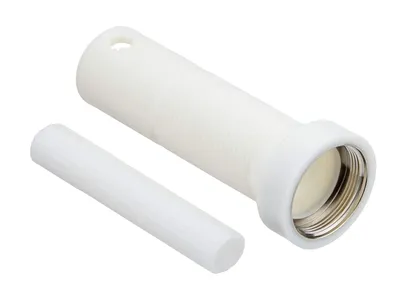 A white plastic extension set for a faucet valve is shown on a white background. A smaller cylindrical piece is placed in front of the larger piece.