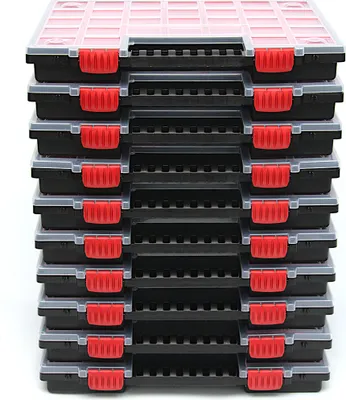 A stack of black storage boxes with red latches and transparent lids.