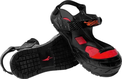 A pair of black and red safety overshoes are shown against a white background.