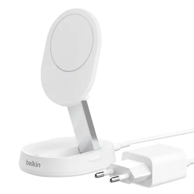 A white wireless charger with a stand and a white power adapter with European plugs.