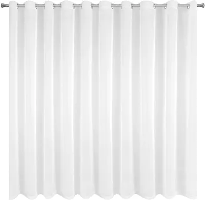 A white curtain hanging from a rod.