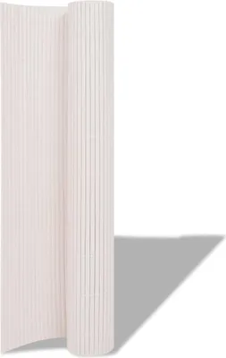 A rolled-up white garden fence is shown against a white background.