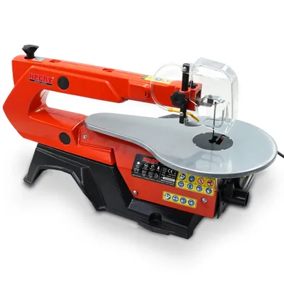 A studio shot of an orange and black scroll saw against a white background.