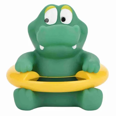 A green toy alligator with a yellow life preserver.