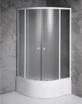 A shower enclosure with frosted glass doors and a white base, set against a textured gray wall.